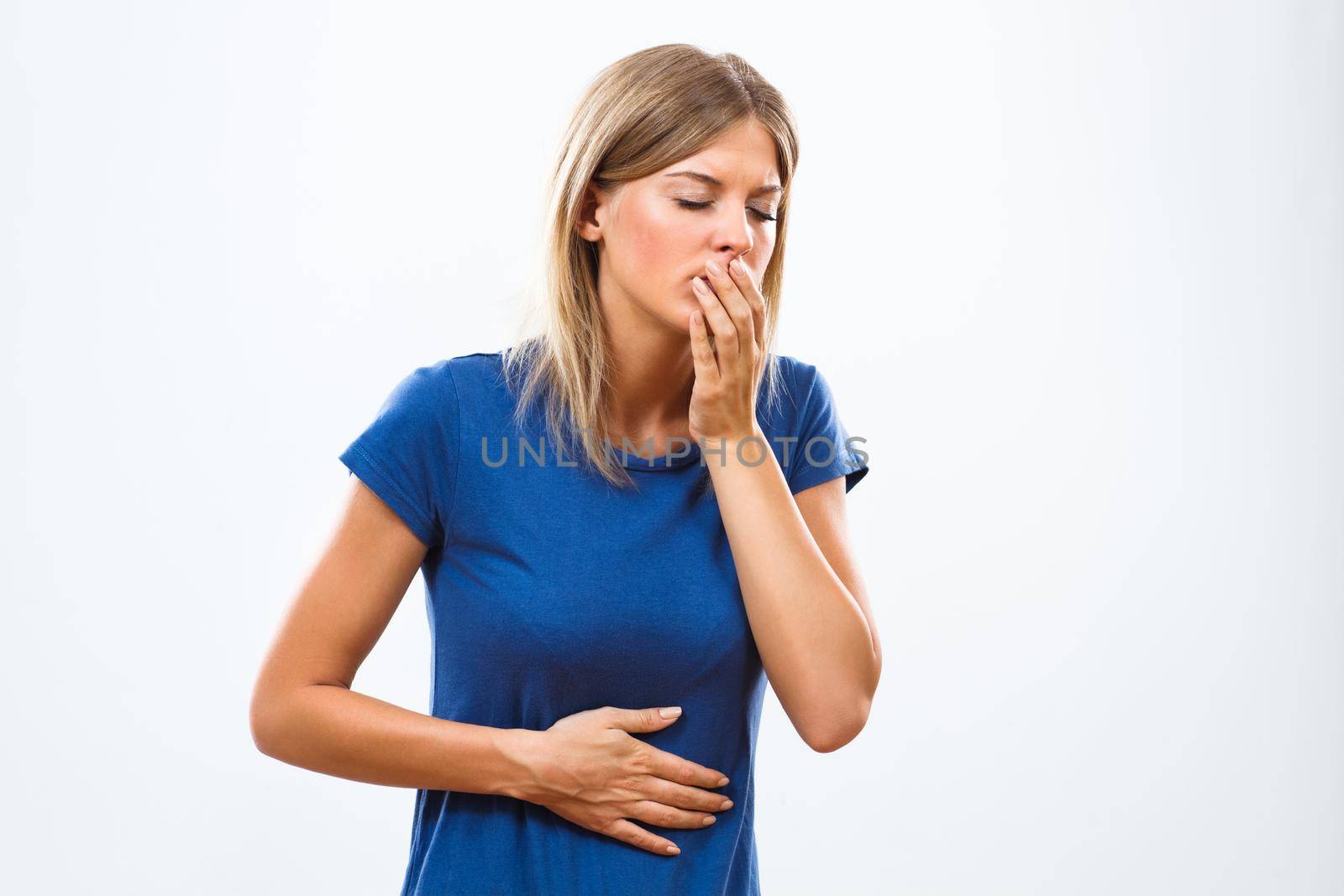 Young woman feeling sick isolated on white background