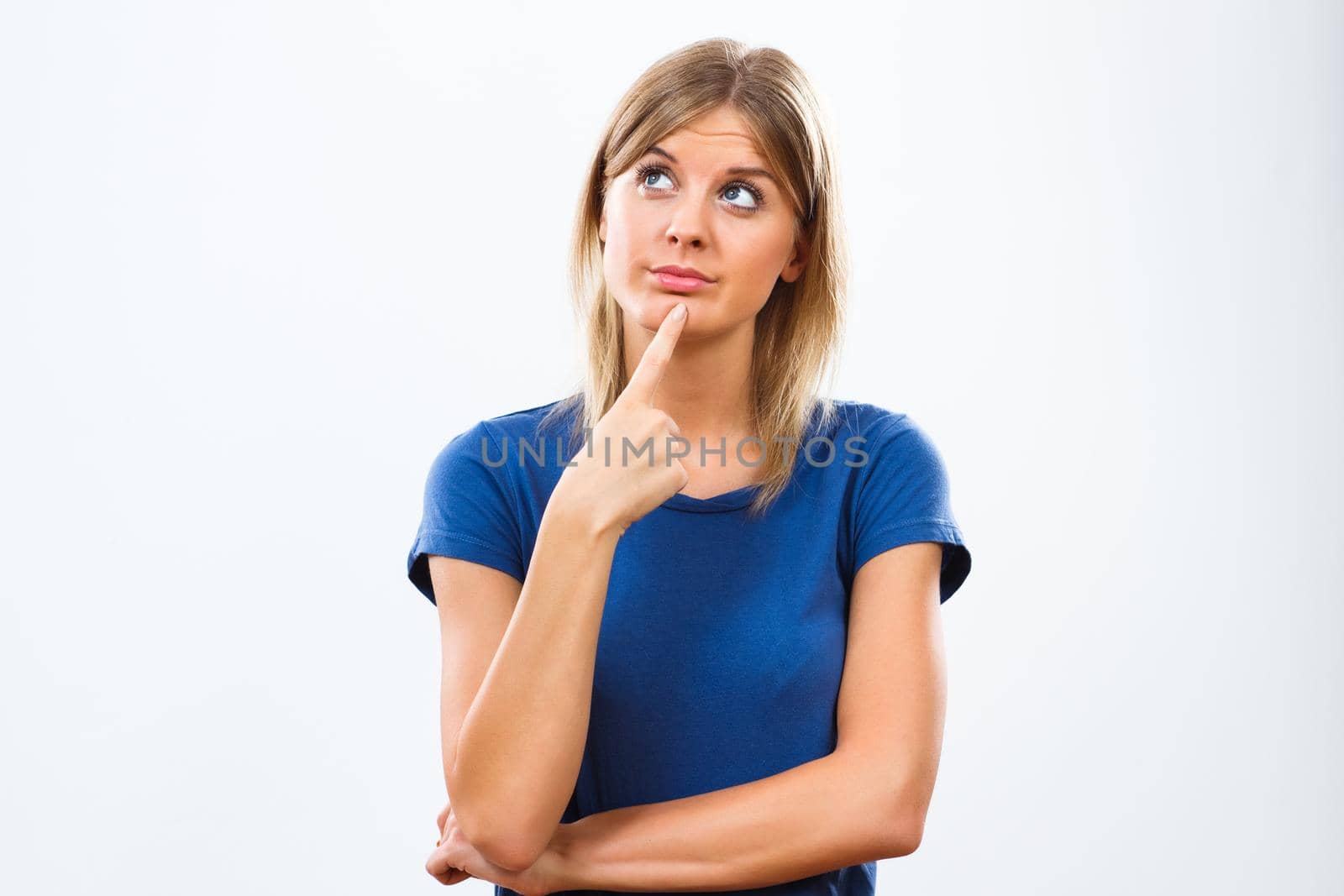 Young woman thinking isolated on white background