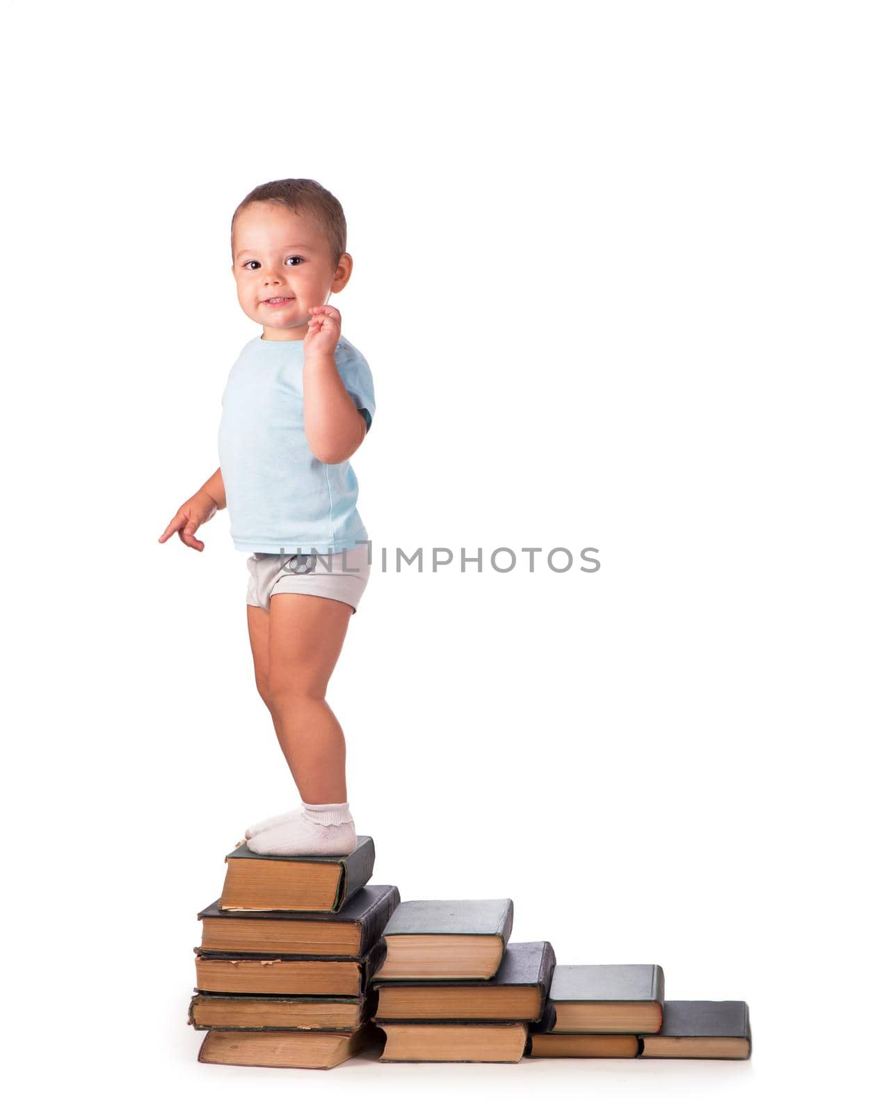 Boy with books for an education portrait - isolated over a white background