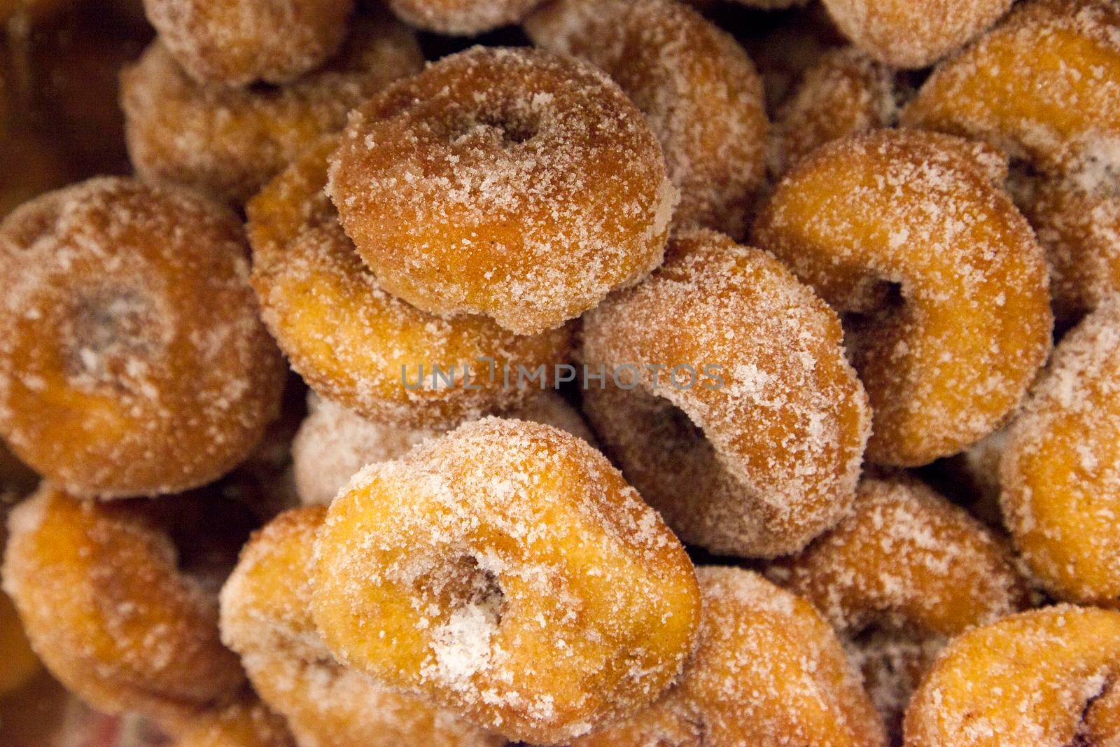  a batch of freshly baked sugar donuts 