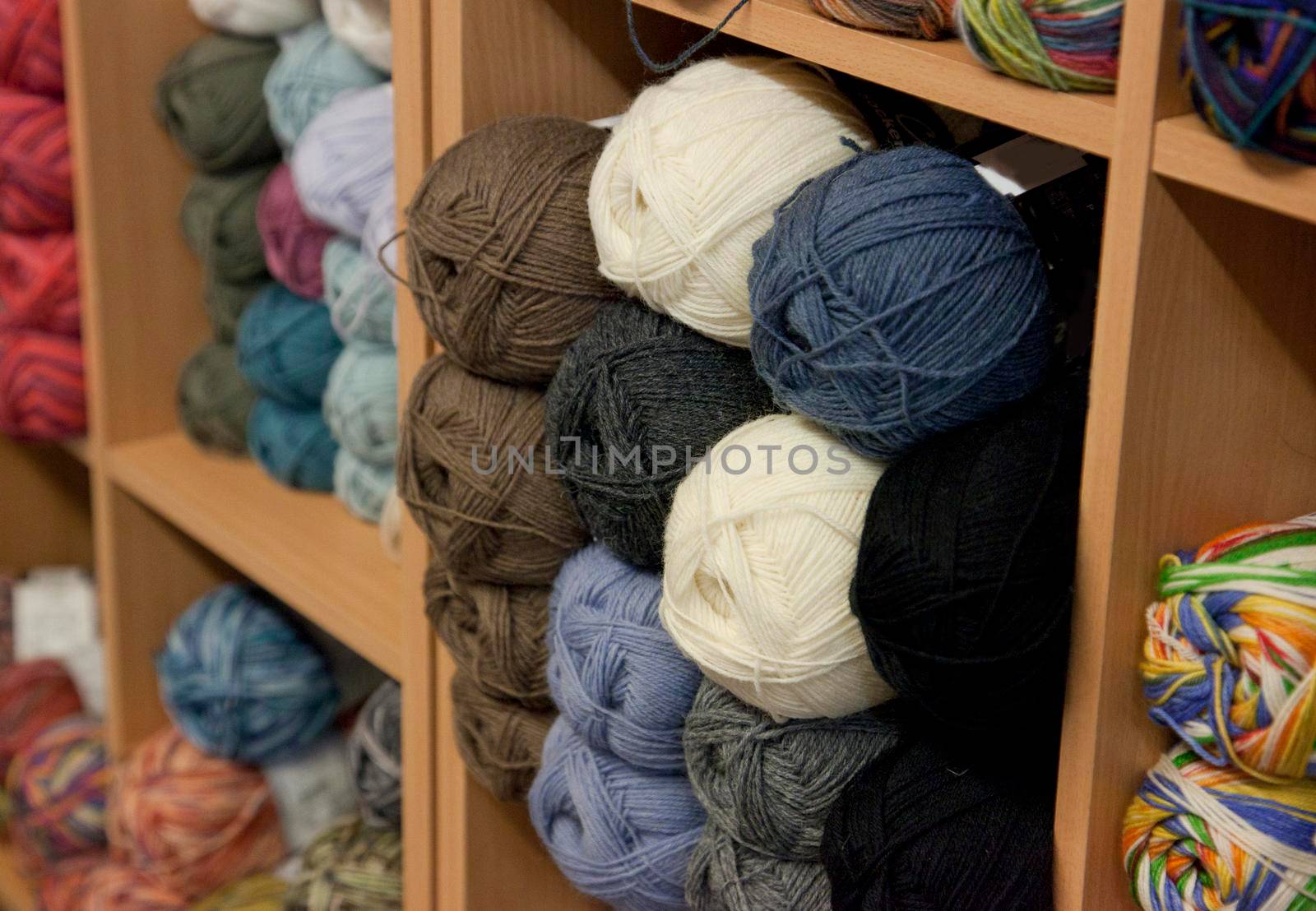 colored balls of yarn or wool in a shop 