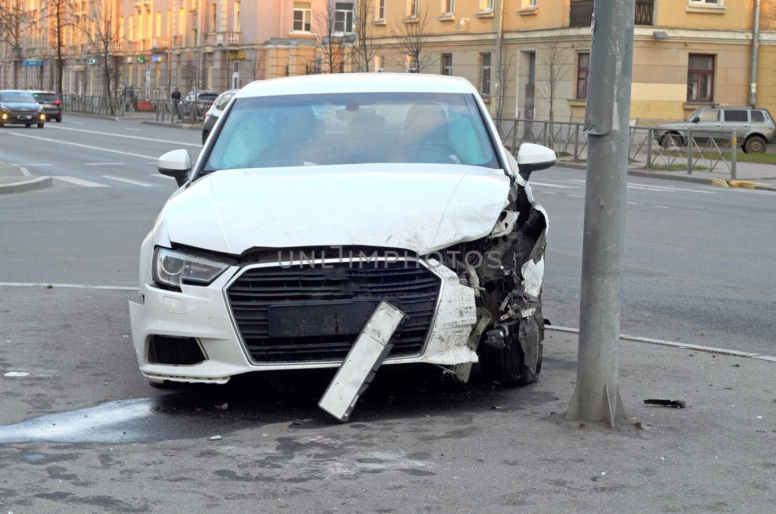 The front part of the damaged car as a result of the accident at the pole.Car accident insurance.