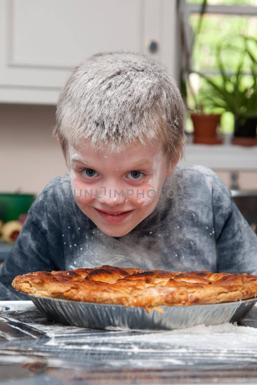 boy covered in flour by pie  by rustycanuck