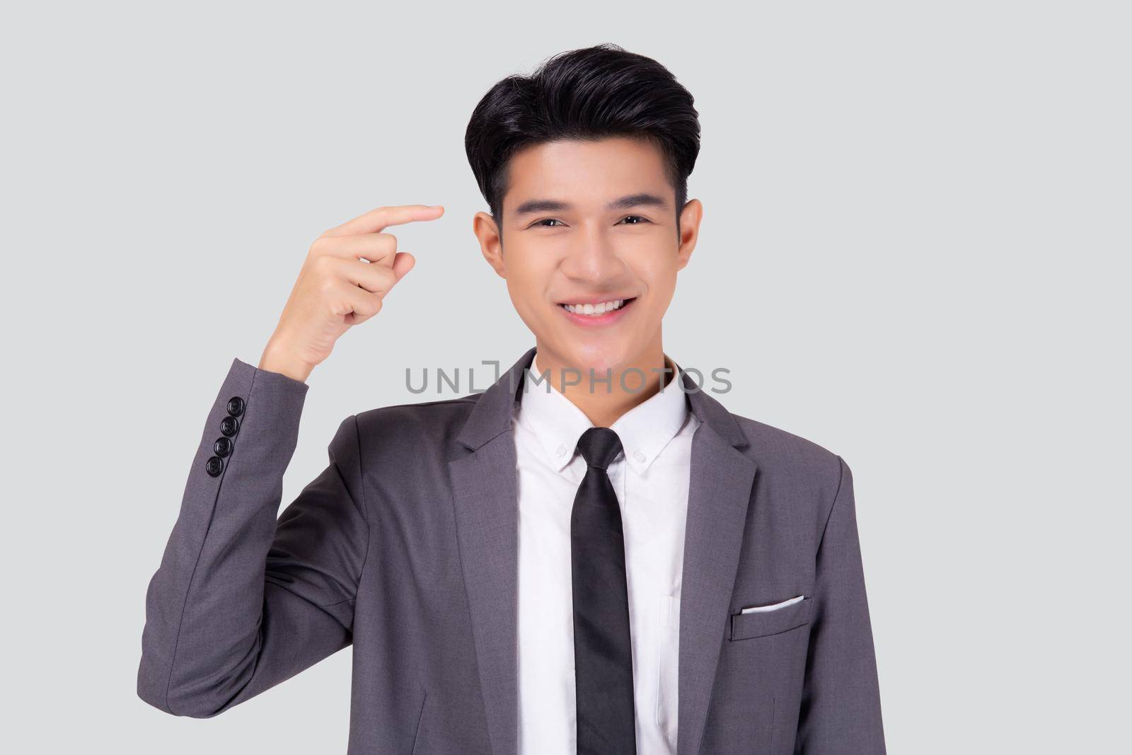 Portrait young asian business man in suit with smart thinking idea with intelligent isolated on white background, businessman standing and planning for success, manager or executive pointing head.