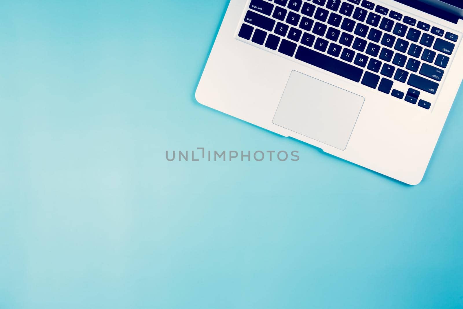 Flat lay of Laptop computer on desk in office, workplace and notebook and keyboard, workspace and copy space, top view, object with above, nobody, hipster and contemporary, business concept. by nnudoo