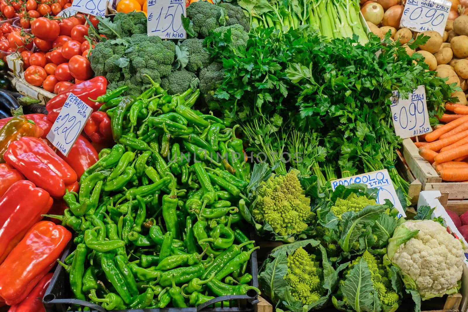 Chili, broccoli and other vegetables for sale at a market