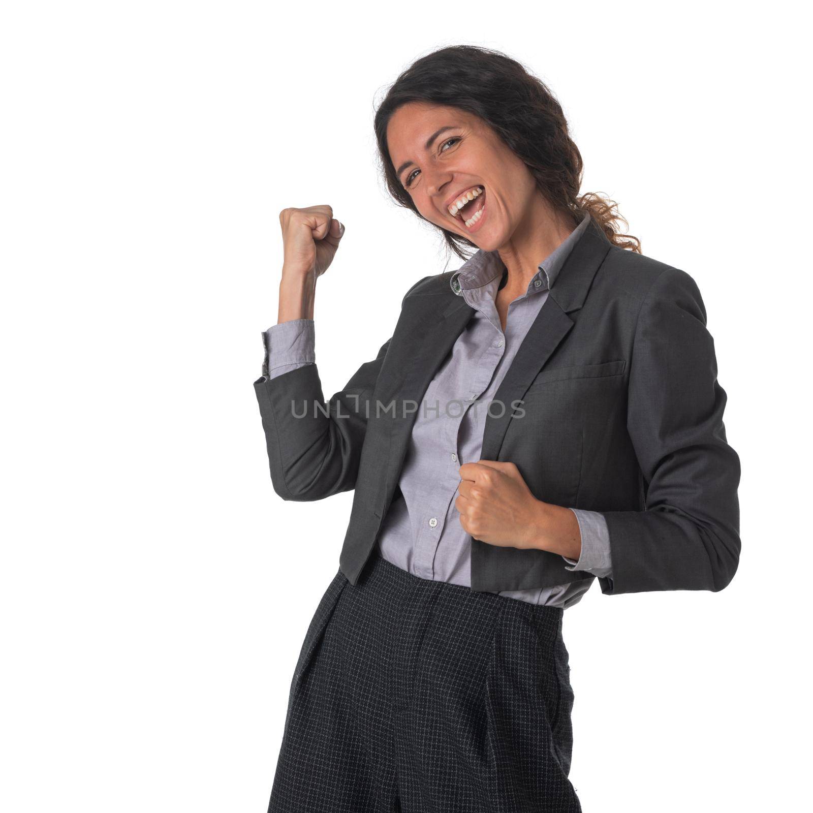 Portrait of young excited happy smiling business woman holding fists studio isolated on white background