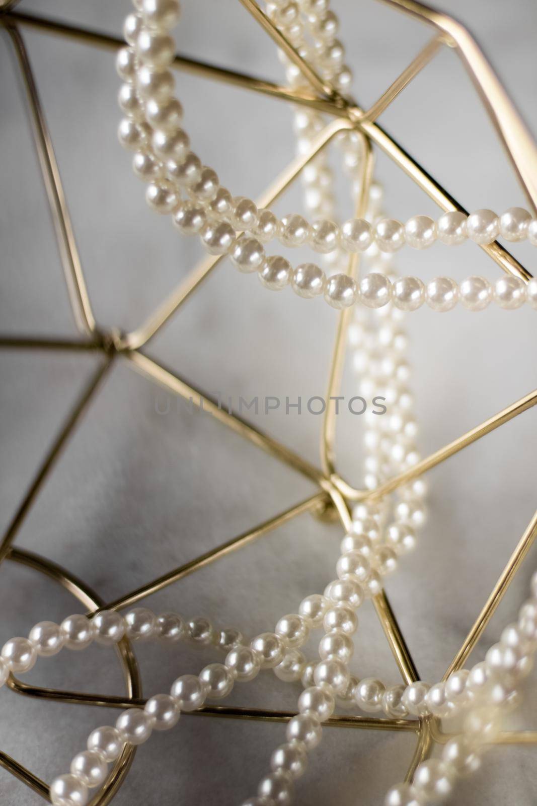 Pearl necklace on golden marble, ethical jewellery - luxury background, jewelry as a gift concept. Pearls are girl's best friends