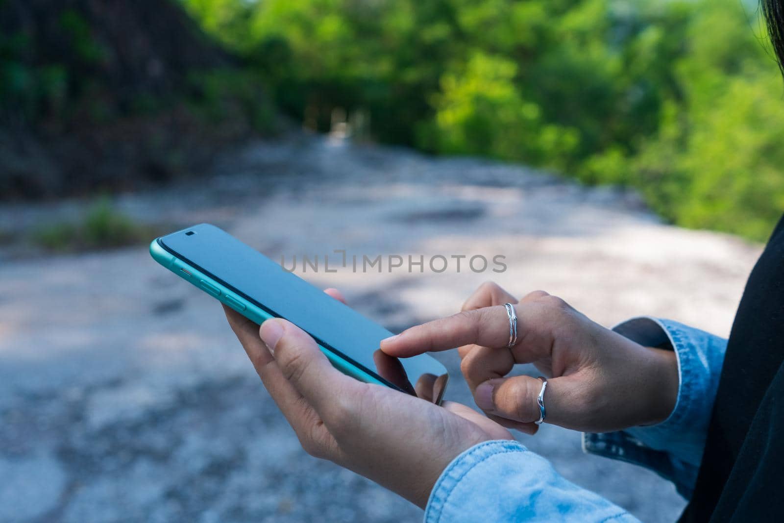 Woman hand using smartphone to do work business, social network, communication. by Suwant