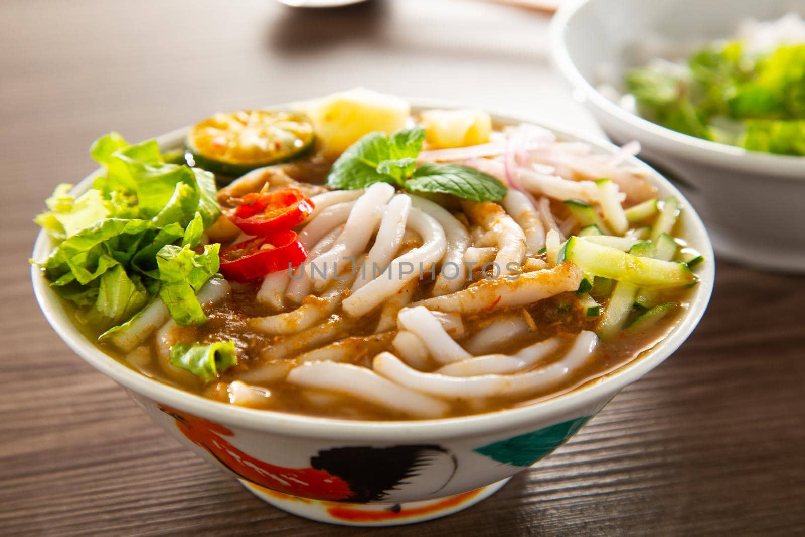 Assam Laksa (Noddle in Tangy Fish Gravy) is a Special Malaysian Food Popular in Penang by tehcheesiong