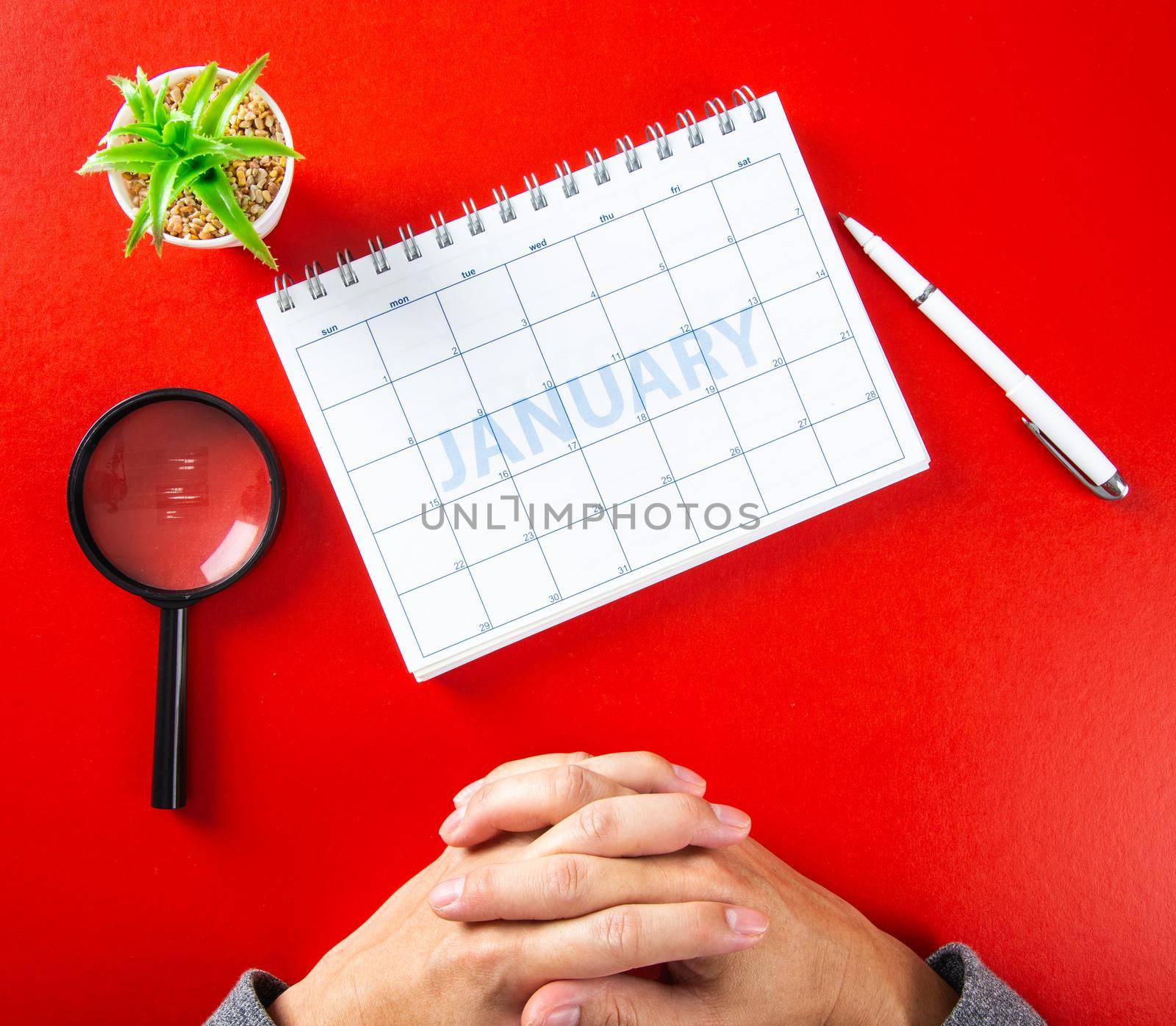 close up of calendar on red background, planning for business meeting