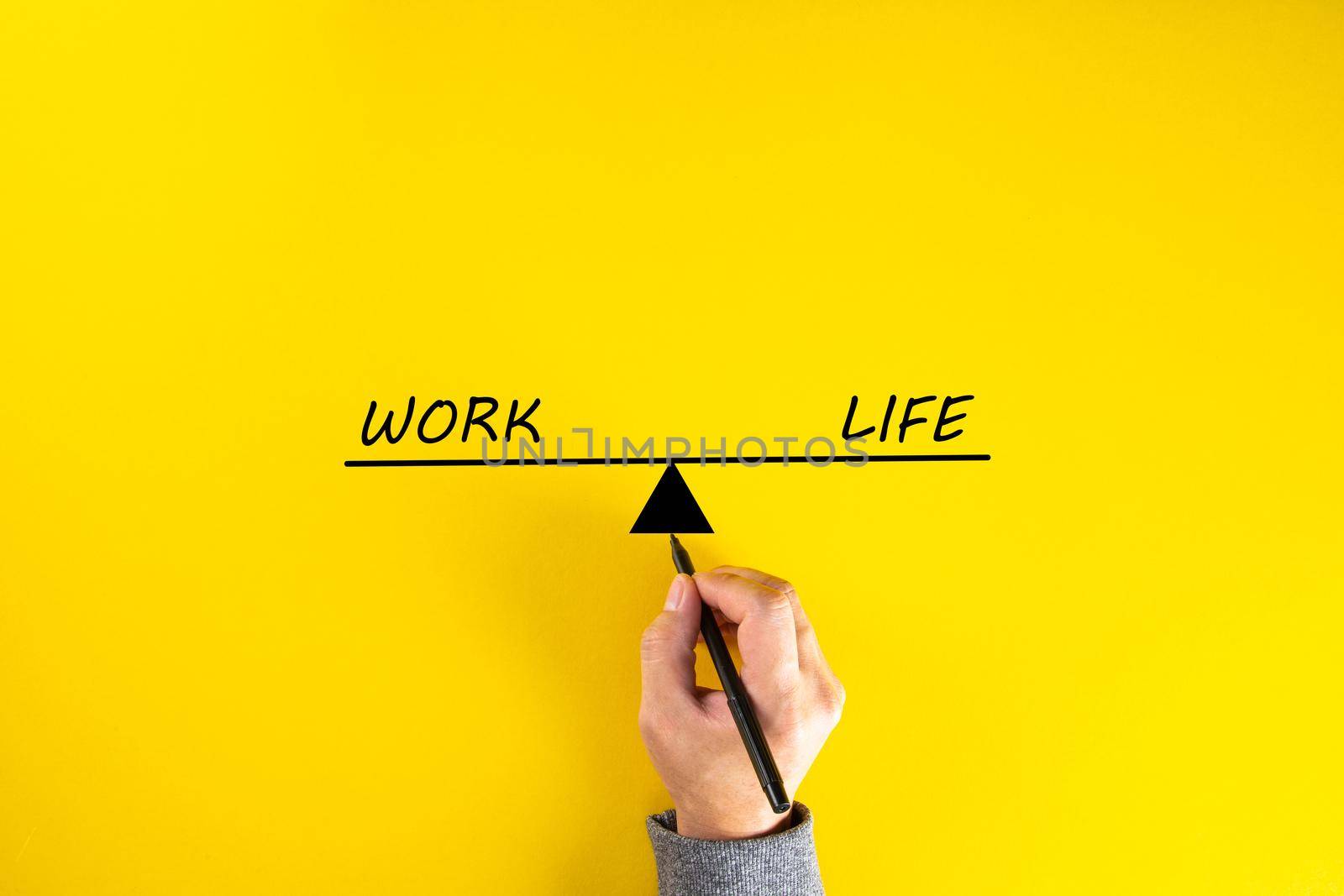 Work and life balance concept, hand drawing on yellow background