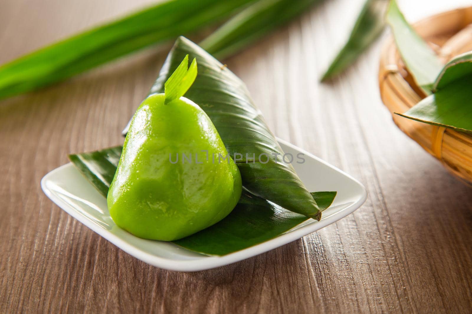 Kuih Koci, traditional Malaysian Nyonya sweet cake. Made from glutinous rice flour with coconut filling, wrapped in banana leaves and steamed. by tehcheesiong