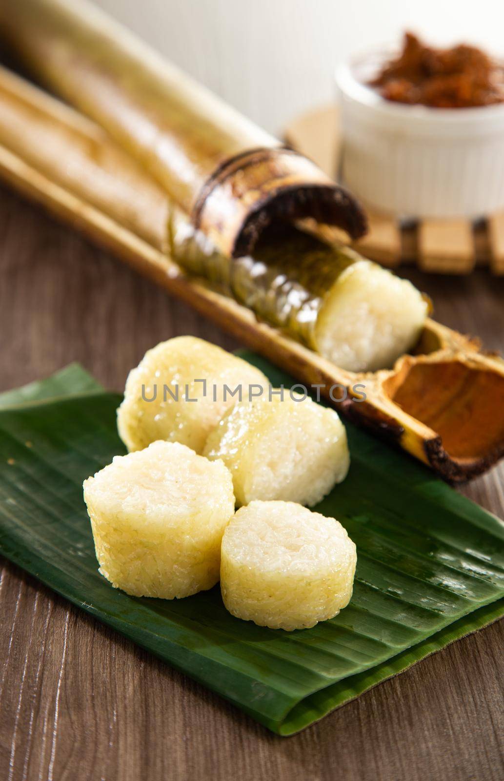 Lemang. Glutinous rice is wrapped with lerek or banana leaf encased in bamboo culm and cooked in open fire.