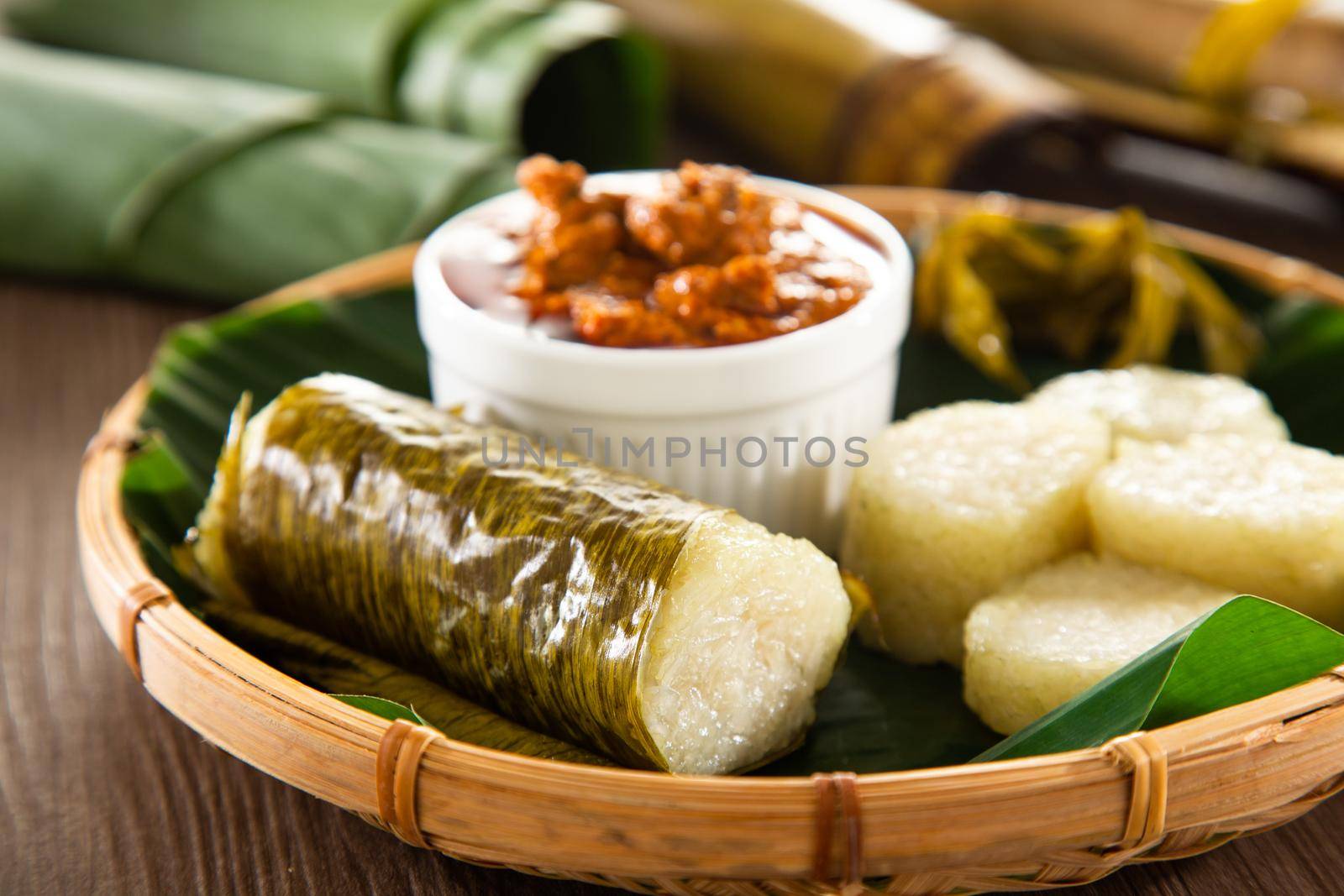 Glutinous rice is wrapped with lerek or banana leaf encased in bamboo culm and cooked in open fire / Lemang / A must have in every traditional Malay household, eaten with beef or chicken rendang by tehcheesiong