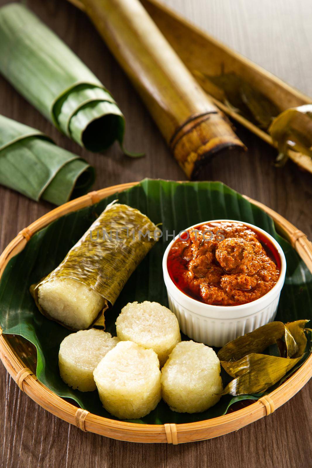 Lemang. Glutinous rice is wrapped with lerek or banana leaf encased in bamboo culm and cooked in open fire.