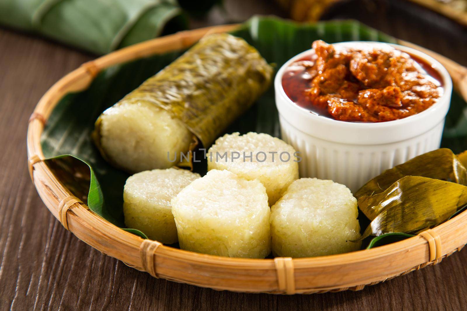 Lemang. Glutinous rice is wrapped with lerek or banana leaf encased in bamboo culm and cooked in open fire.