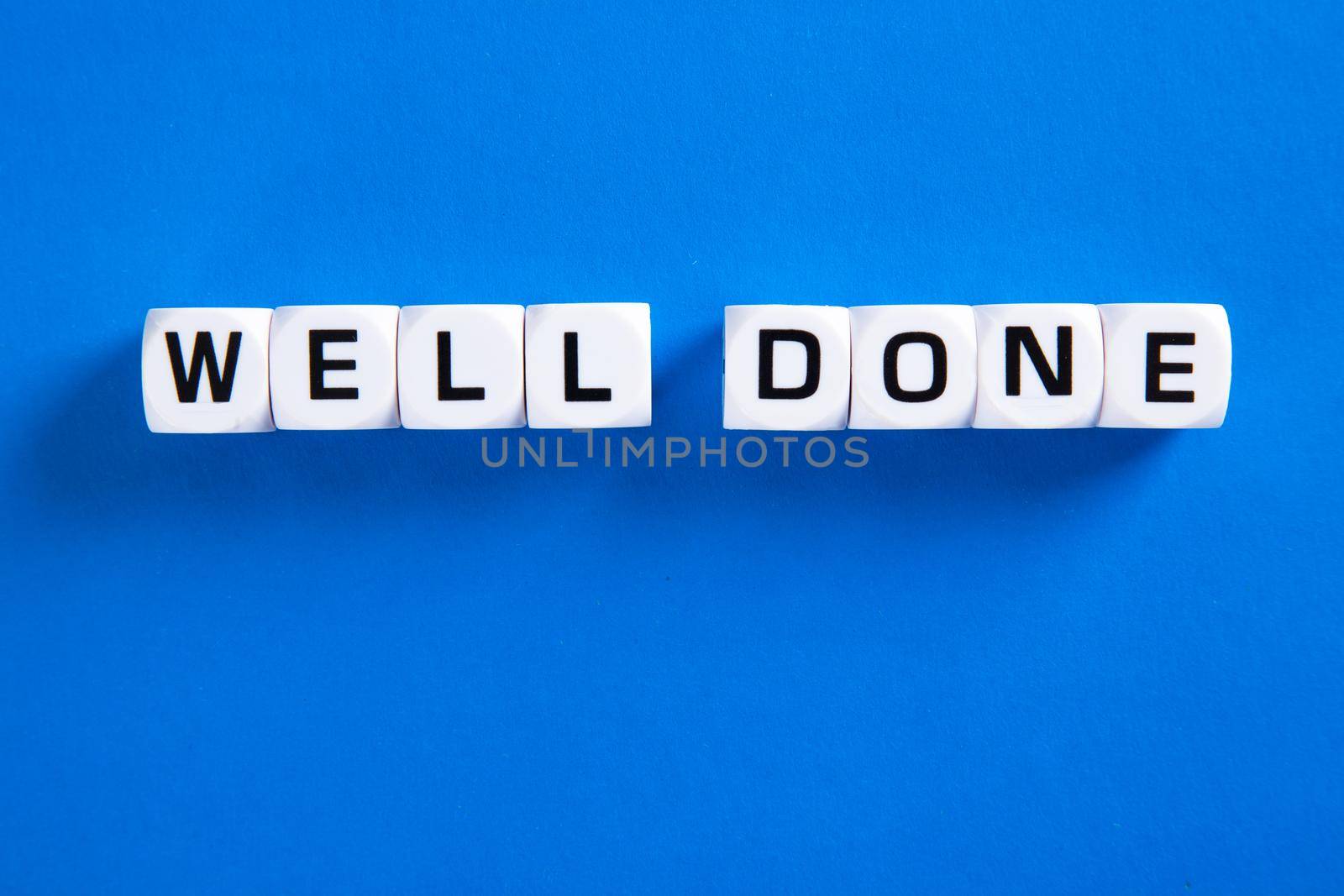 Well done phrase letters on blue background