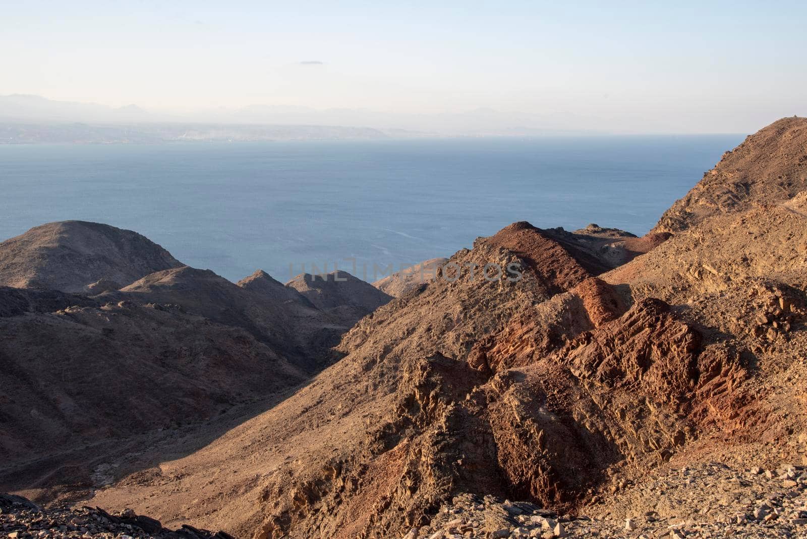 Arid desert mountains against the backdrop of the Red Sea. Shlomo mountain, Eilat Israel. Morning Daylight . High quality photo