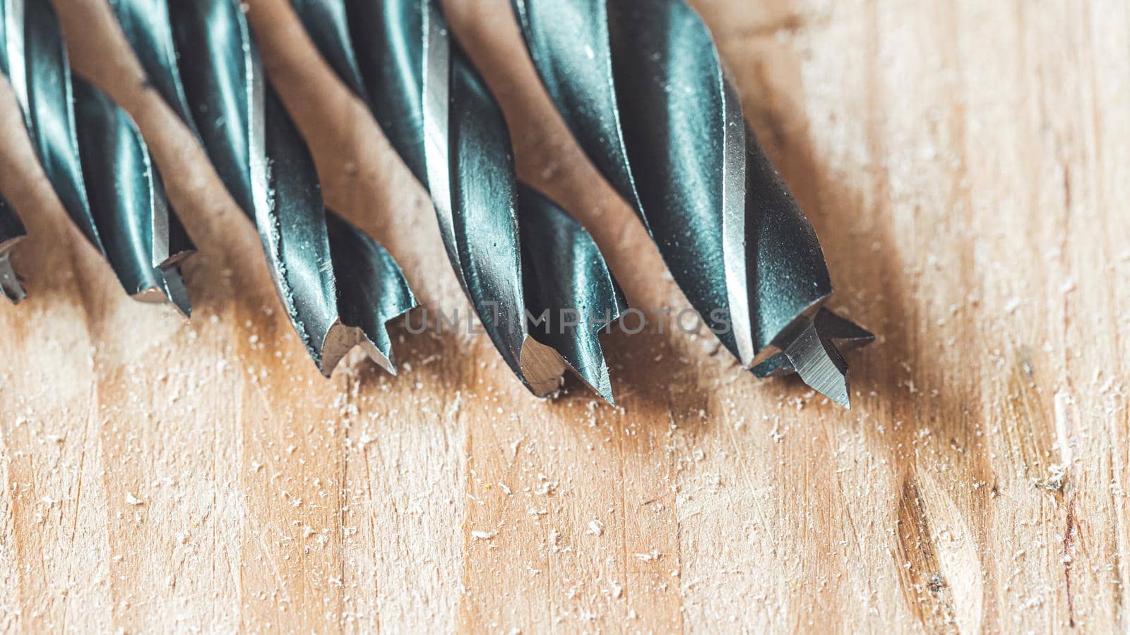Close up of driller lying on wooden plank