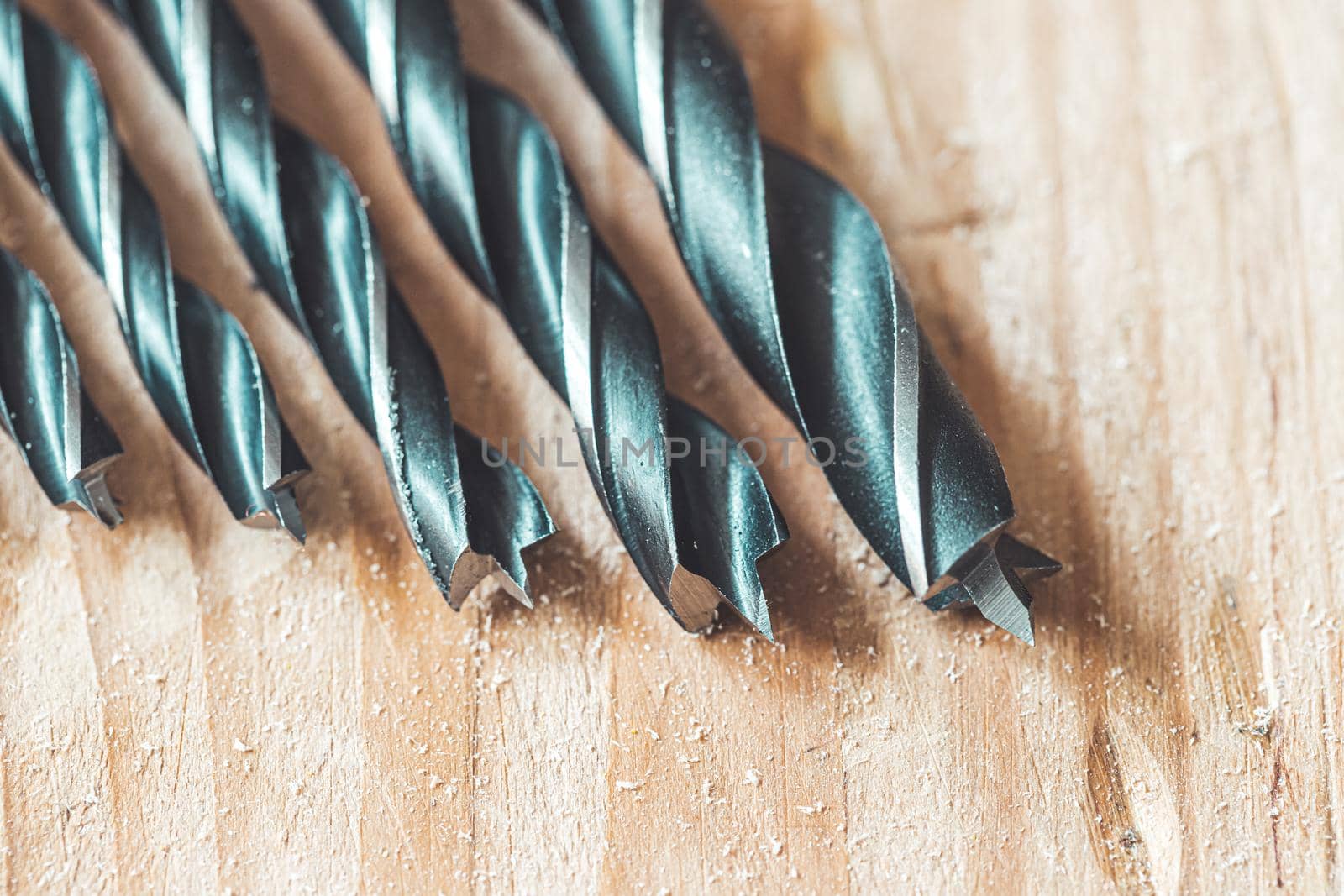 Close up of driller lying on wooden plank