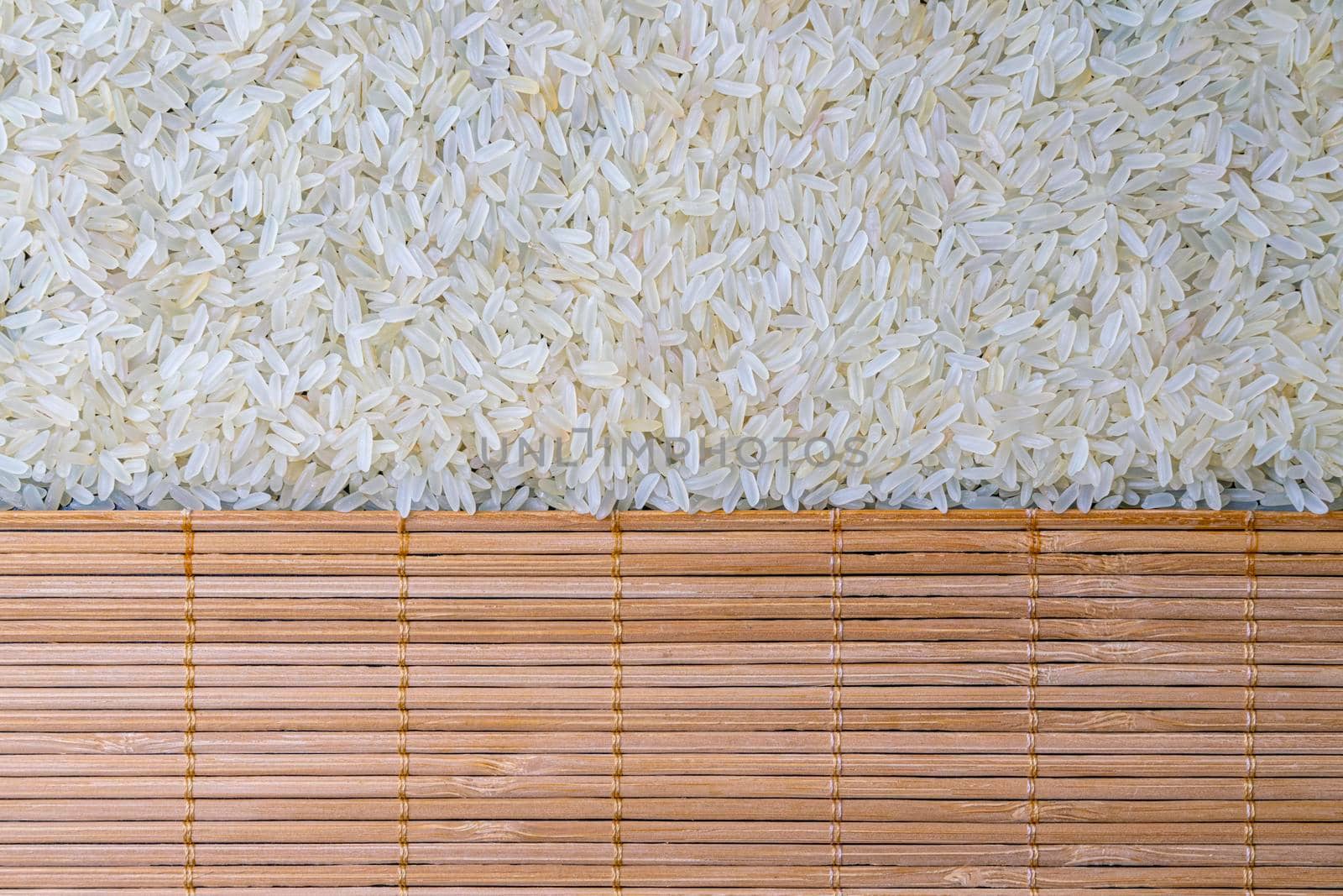 texture of rice grains on a bamboo table close-up. High quality photo