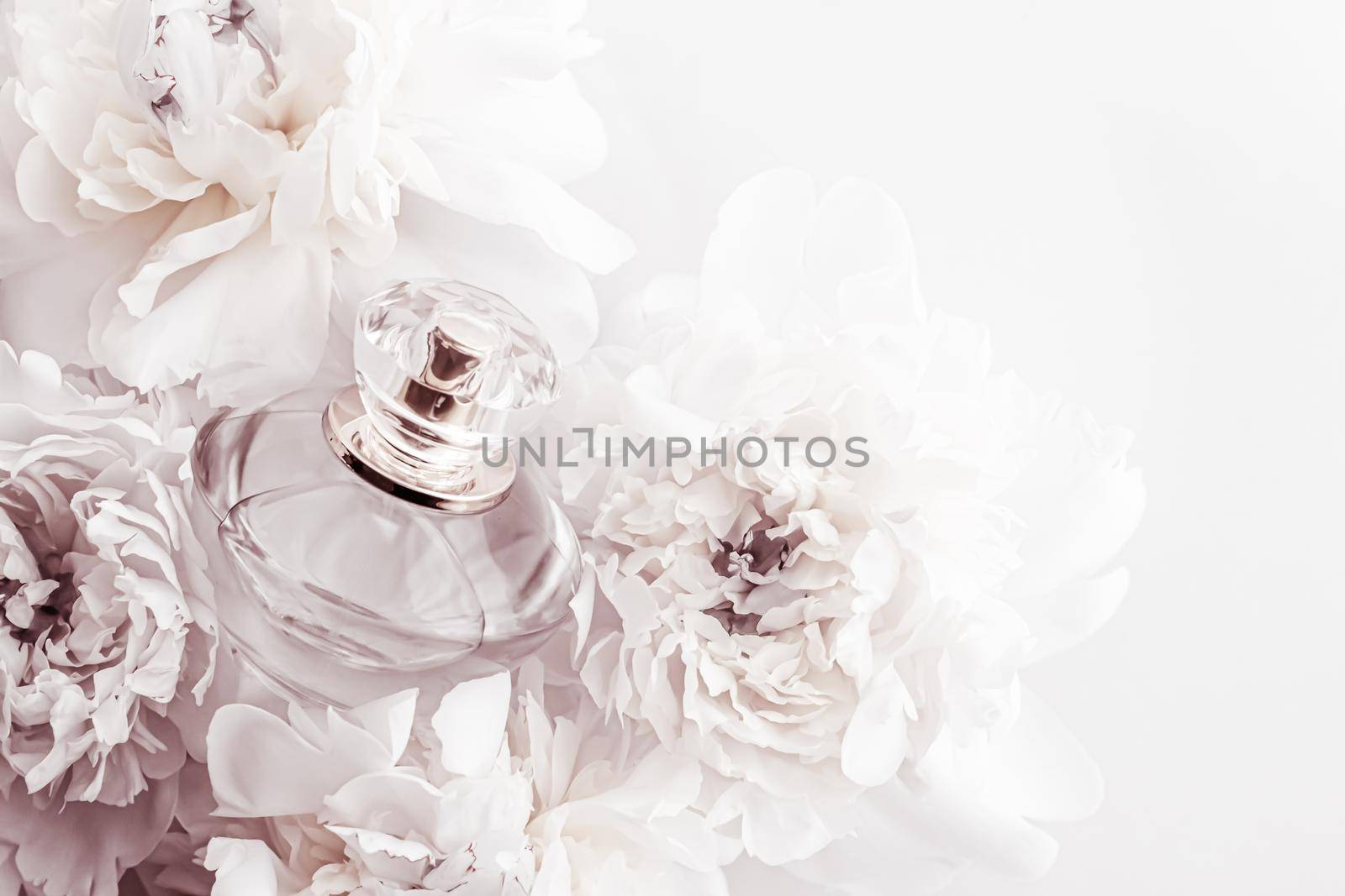 Chic fragrance bottle as luxe perfume product on background of peony flowers, parfum ad and beauty branding by Anneleven