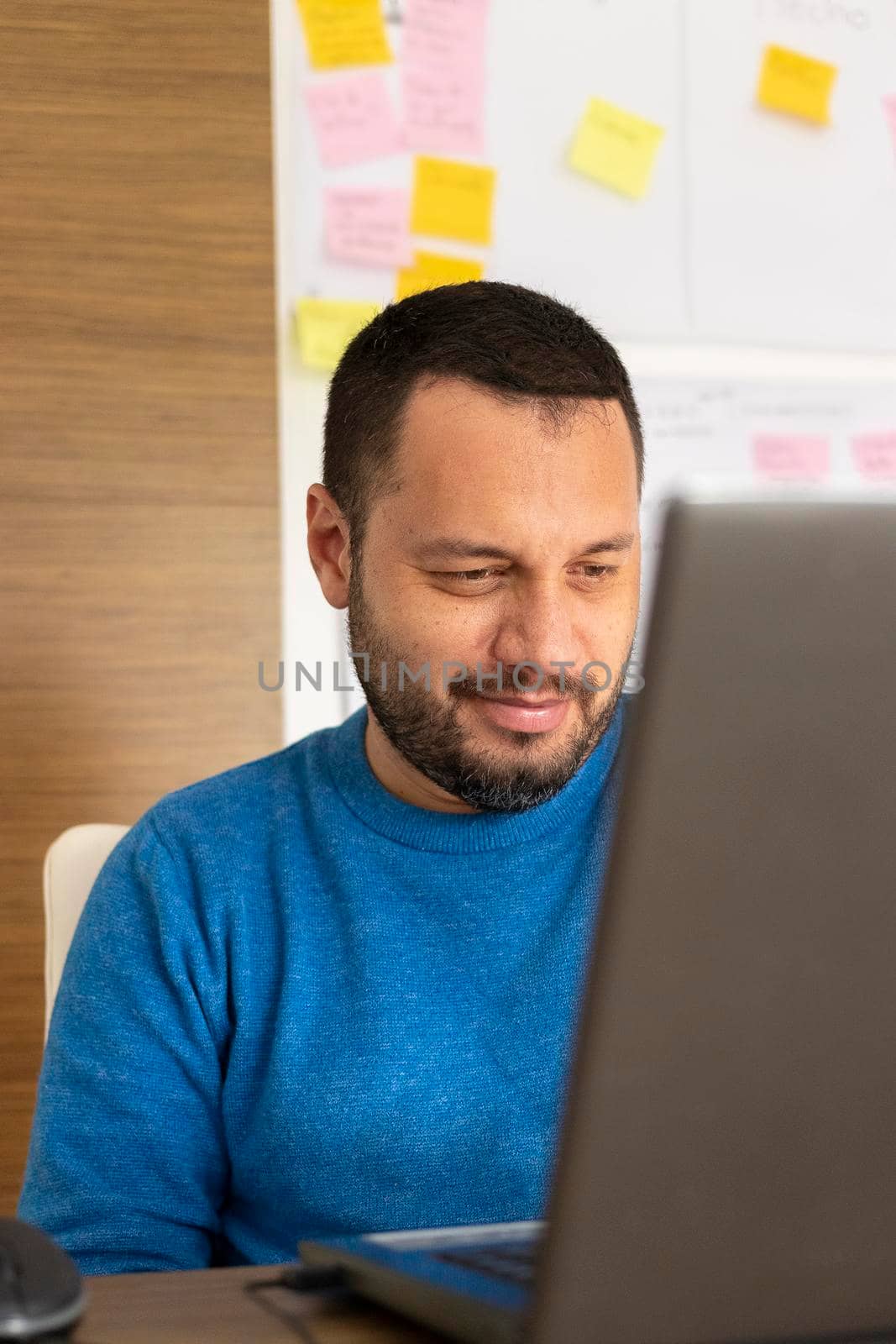 Young man working with his laptop