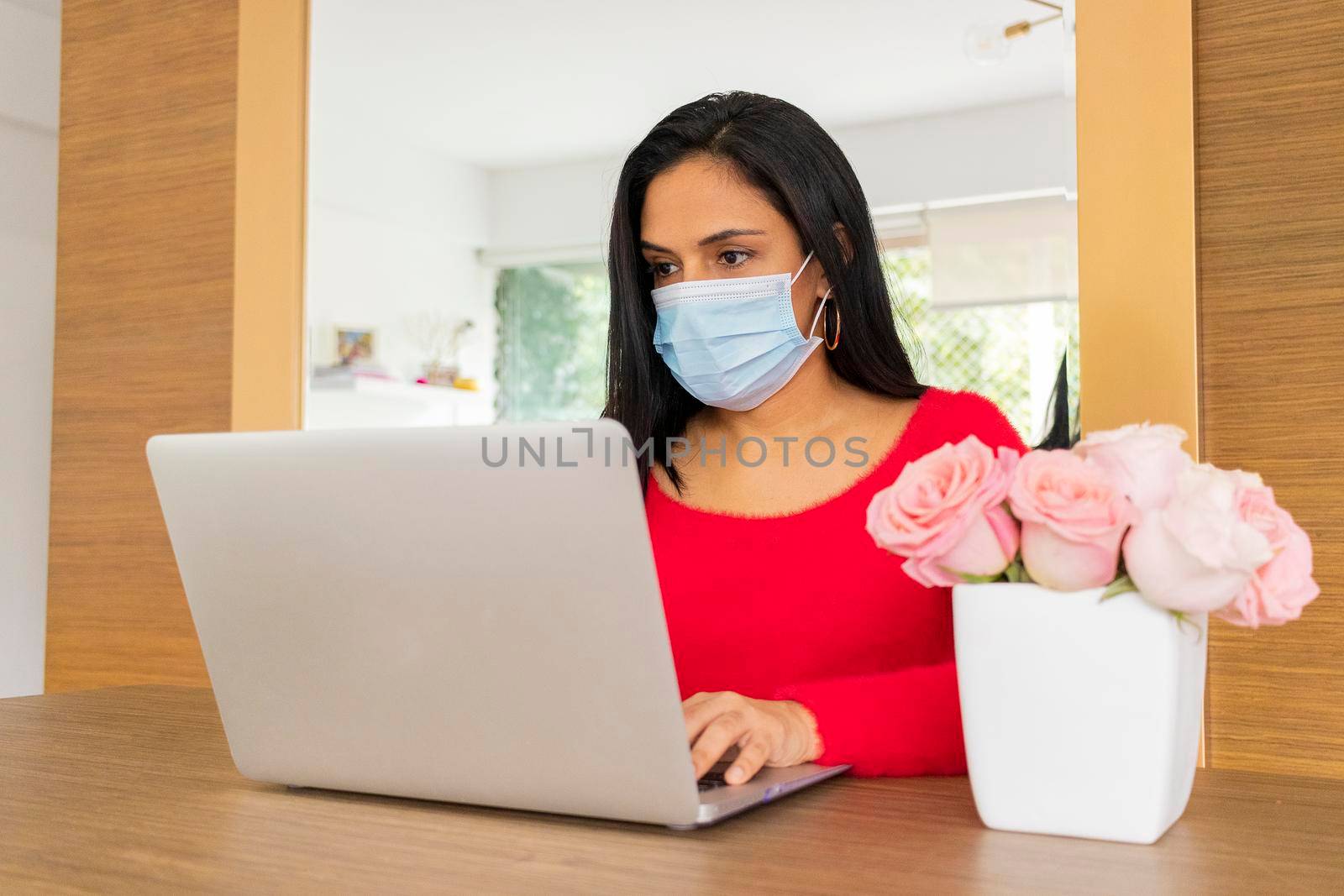 Beauty hispanic woman is working at home by eagg13