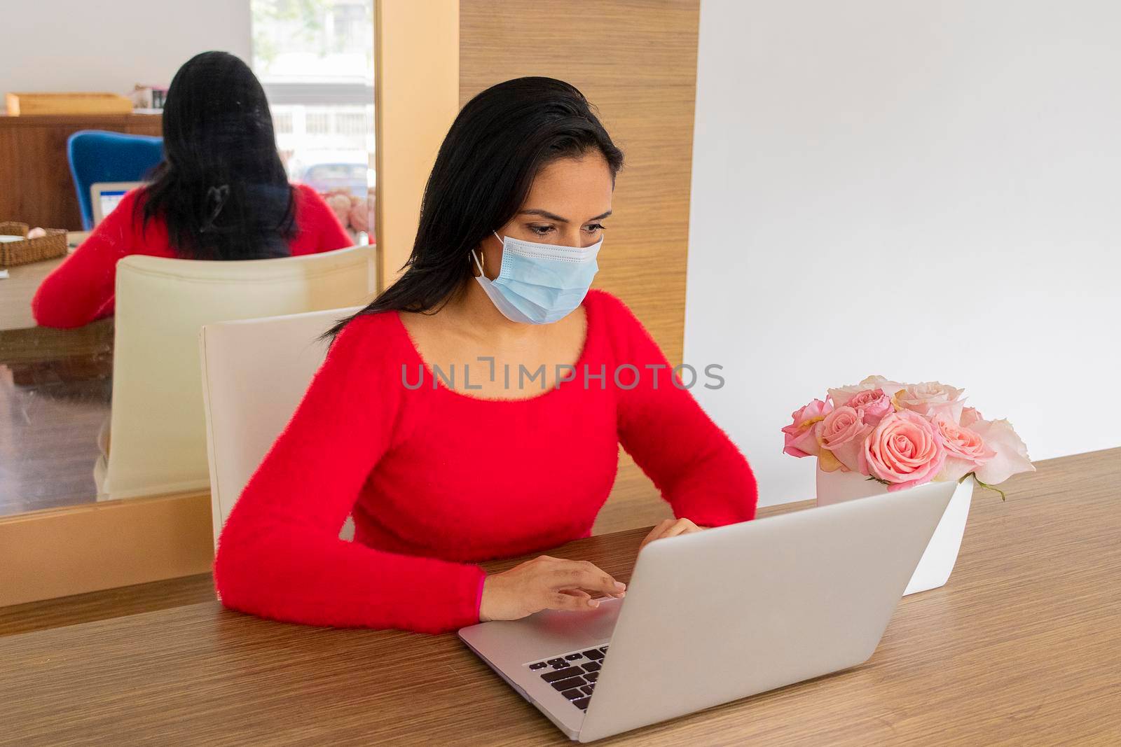 Beauty hispanic woman is working at home
