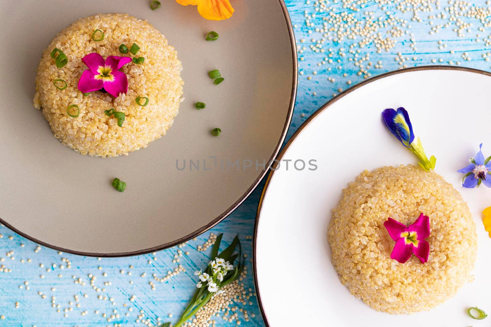 Quinoa plate presentation decorated with edible flowers