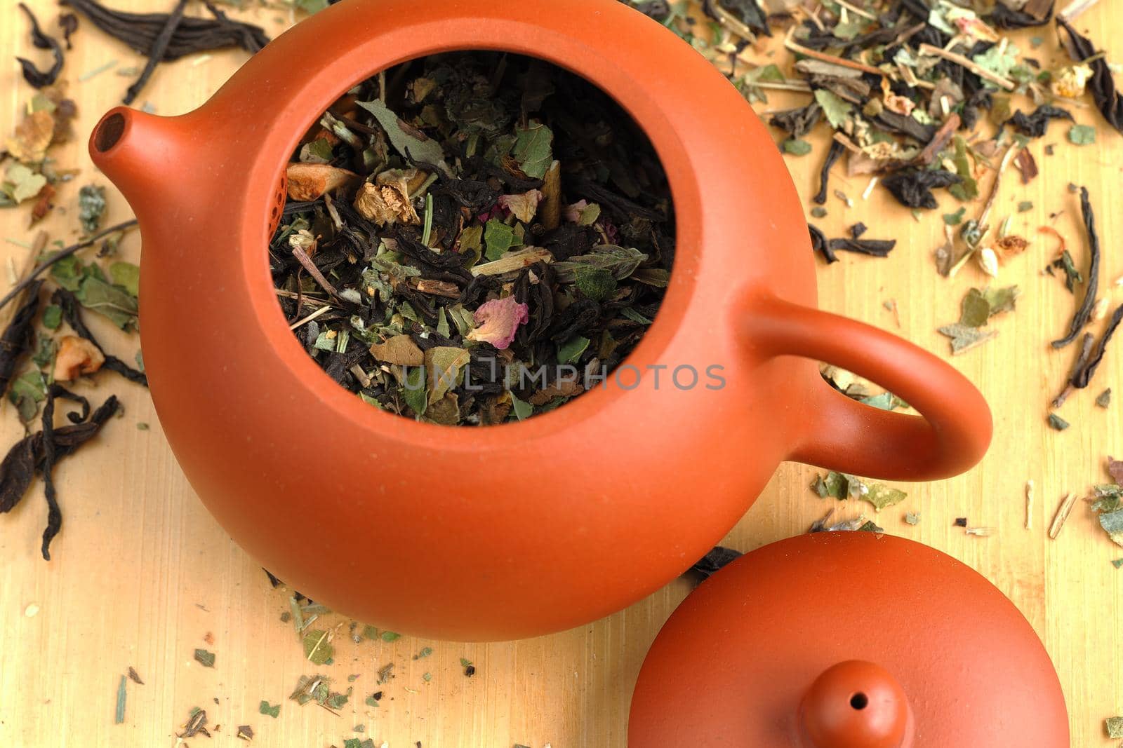 Leaf tea, willow tea, brewed in a clay brown teapot. High quality photo