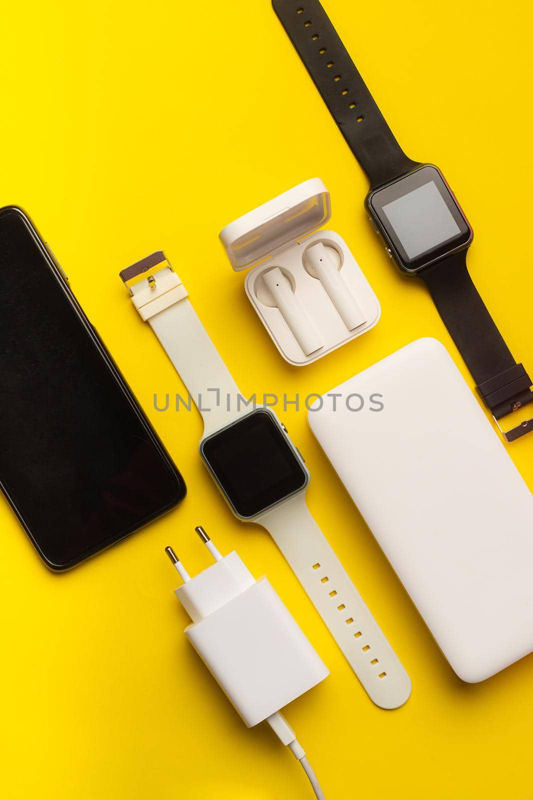 Layout of modern gadgets on a yellow background . Online communication. Internet connection. Mobile communication. 5g. Black and white technology. Modern technologies. Copy space