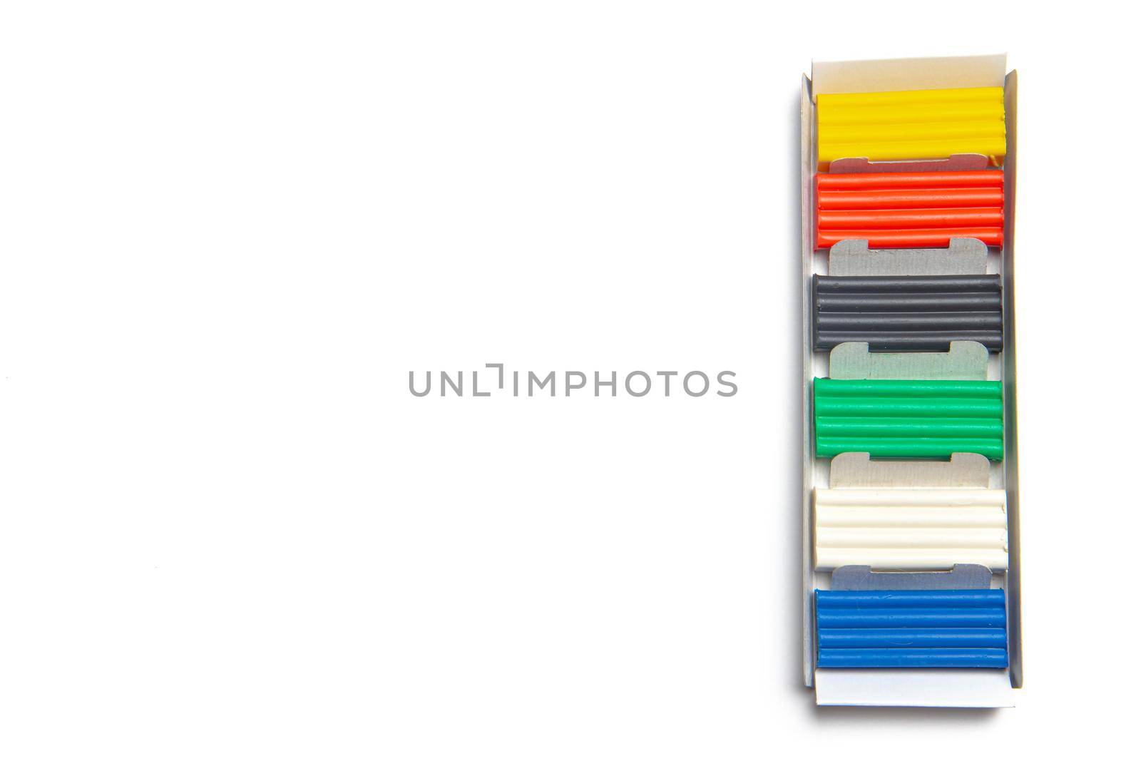 Plasticine isolated on a white background . Hobby. Children's classes. Modeling. Article about children's leisure. Isolated background. Copy space