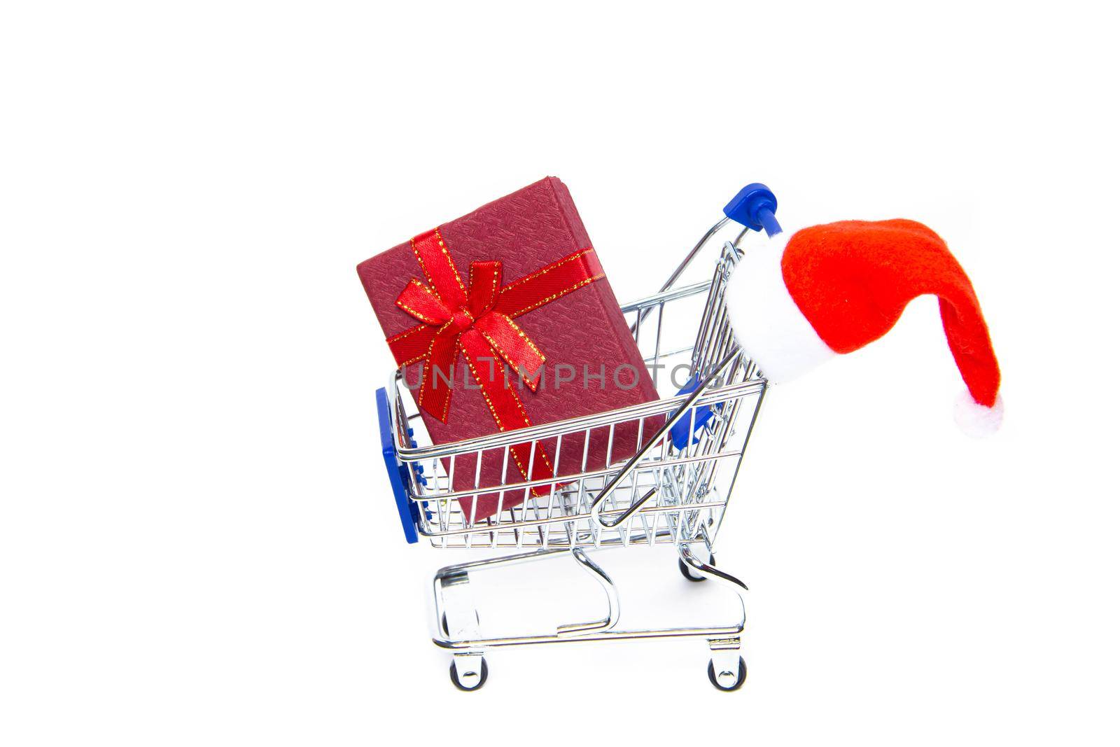 Cart with gifts on a white background . New Year and Christmas. Buying gifts. Online purchases. Preparation for the holiday. The choice of gifts. copy space