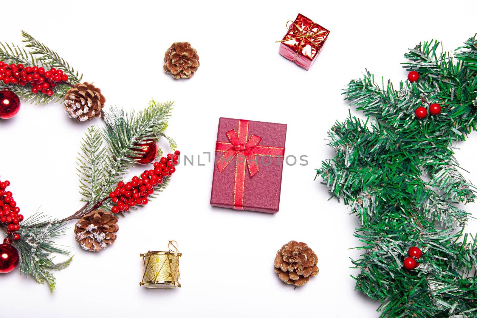 Christmas layout on a white background . Red gifts and fir-tree branches. Christmas and New year. Holiday. Postcard. Design. Copy space