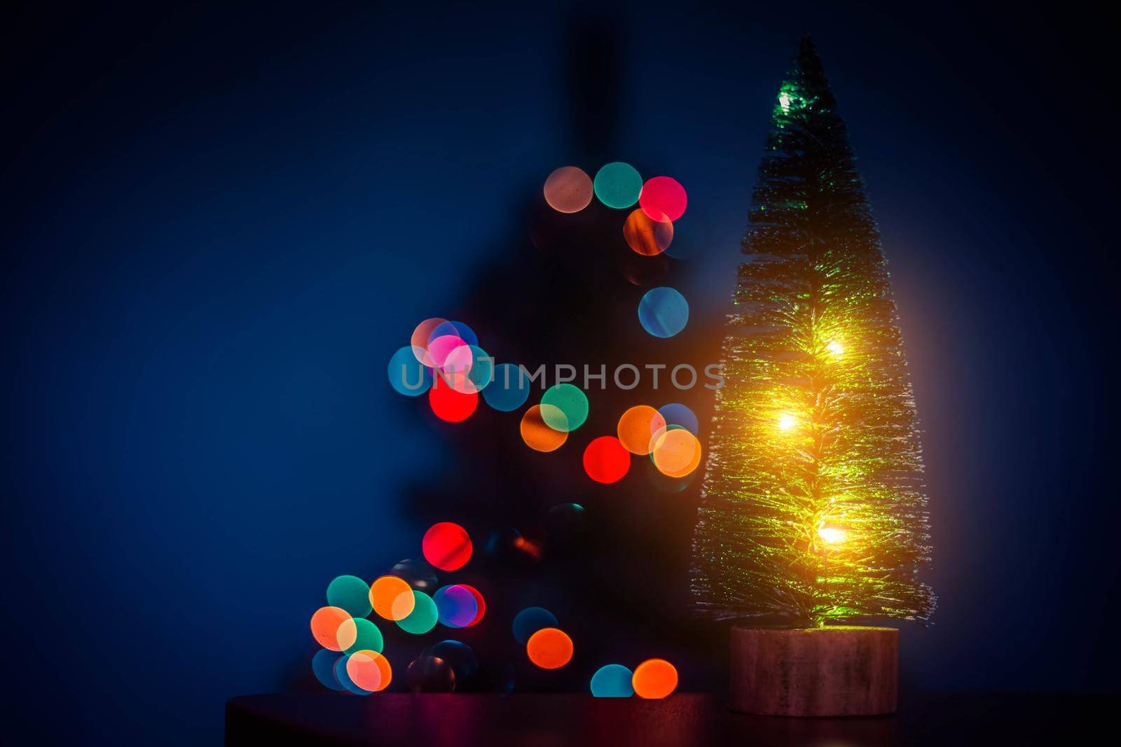 Christmas tree on the background of bokeh lights . Christmas tree. Lights bokeh defocus. New year and Christmas holidays. Holiday article. Copy space