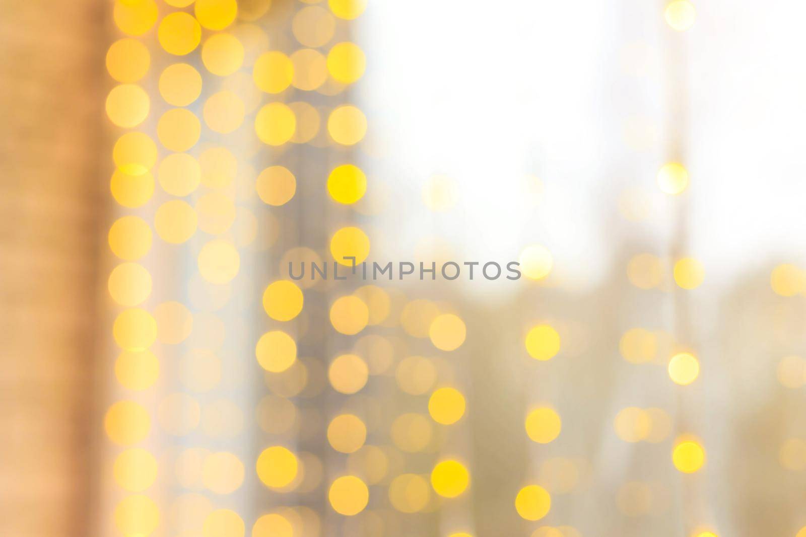 Yellow bokeh lights blur . new year's defocus. lights of the bokeh garland. Copy space by alenka2194