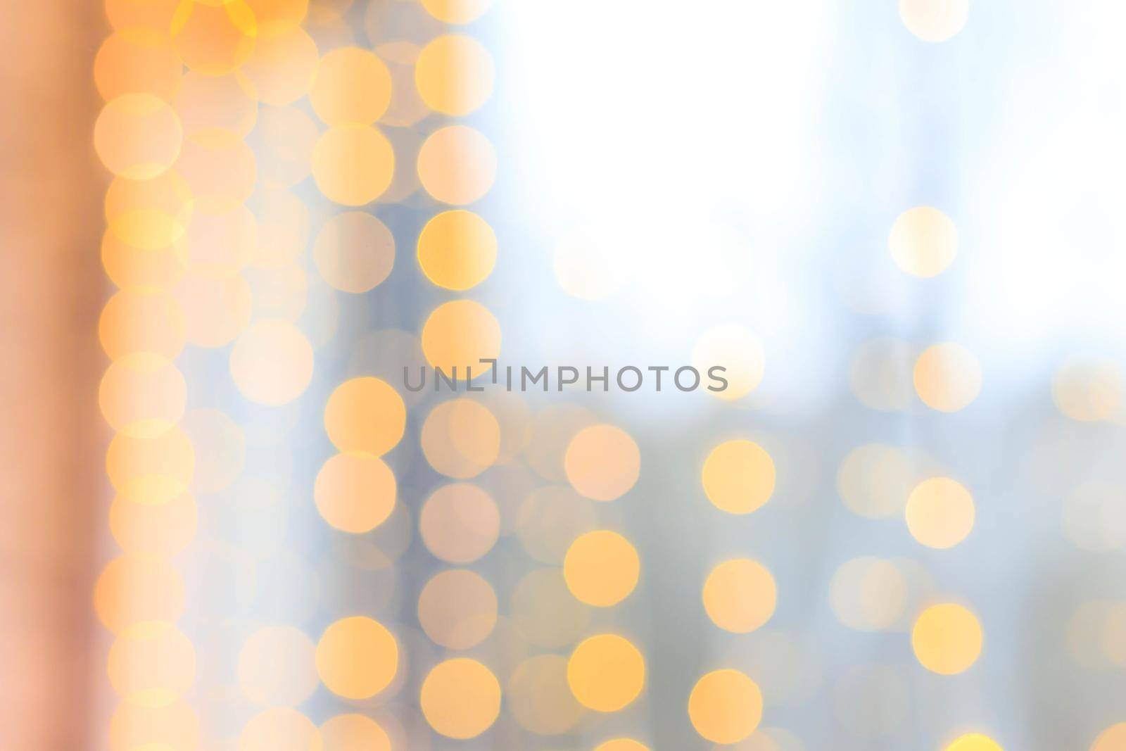 Yellow bokeh lights blur . new year's defocus. lights of the bokeh garland. Copy space to the side