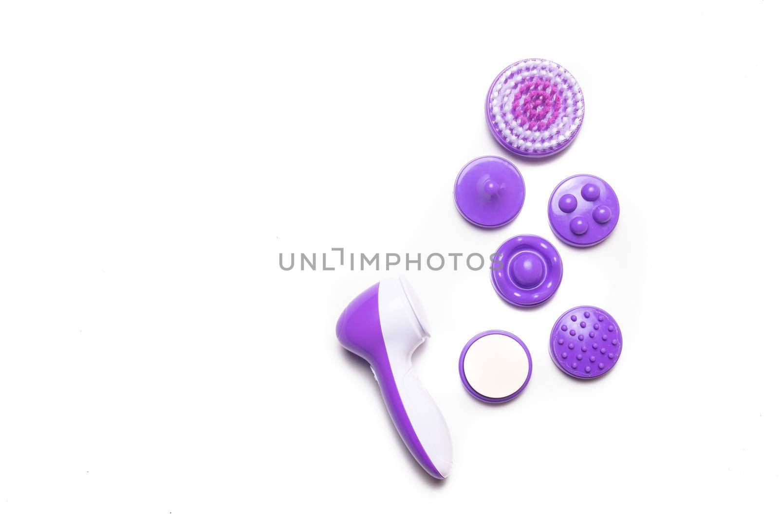 Electric isolate facial massager . Purple massager. Facial care. Cosmetology. Women's care . Article about the health of the face . Isolated object . Copy space