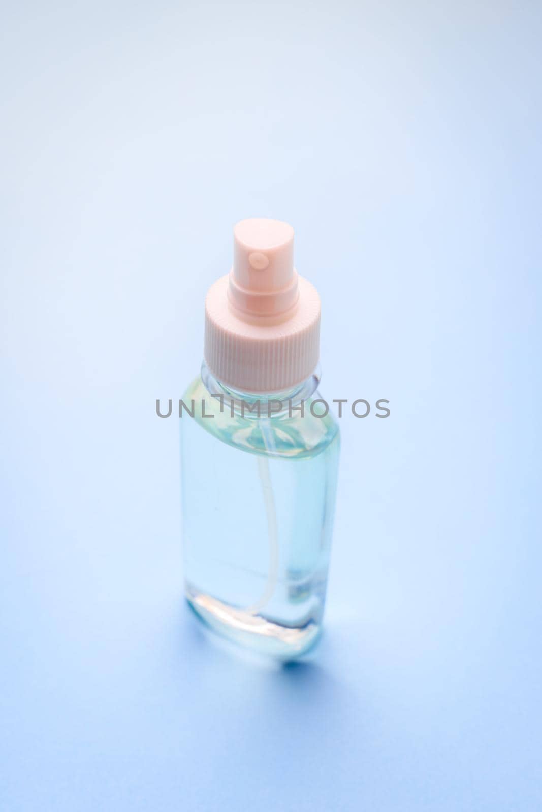 Antiseptic on a blue background . hand treatment. protection from the virus. antibacterial. a jar of antiseptic. coronavirus. pandemic. prevention. Copy space