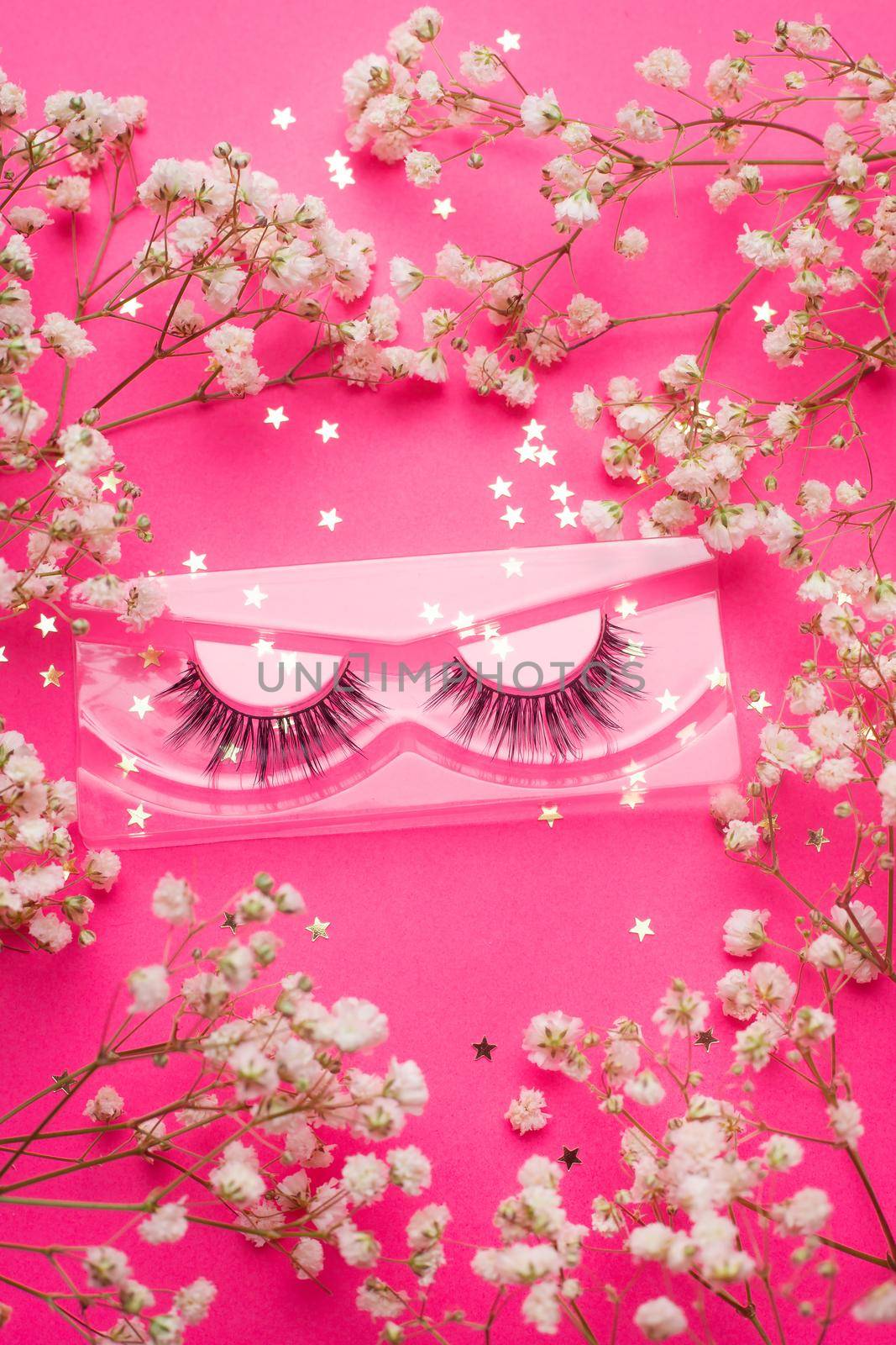 False eyelashes . False eyelashes on a pink background. Layout of the beauty industry. Beauty and fashion. The beauty of women. Trend. Self-care. An article about the choice of false eyelashes and their care. Pink background. Copy space by alenka2194