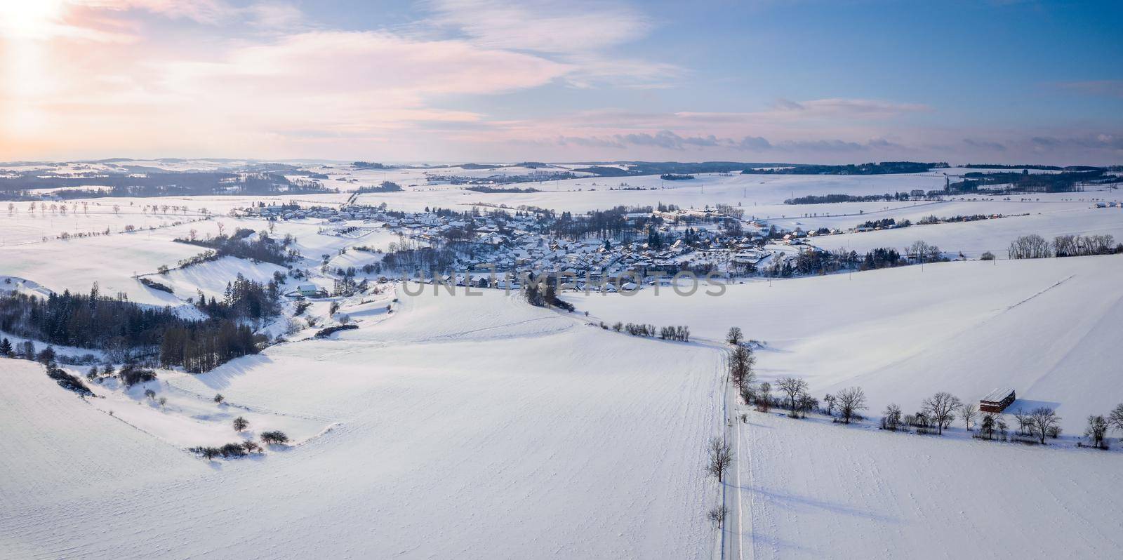 Aerial view of village with residential buildings in winter. by artush
