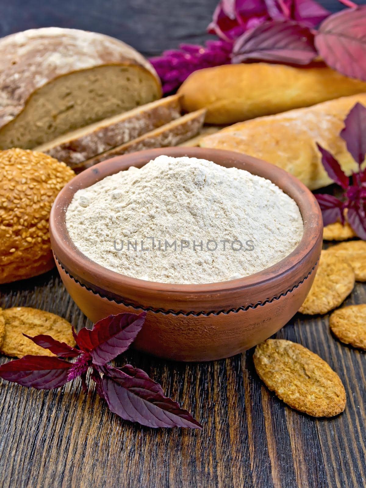 Flour amaranth in clay bowl with cookies on board by rezkrr