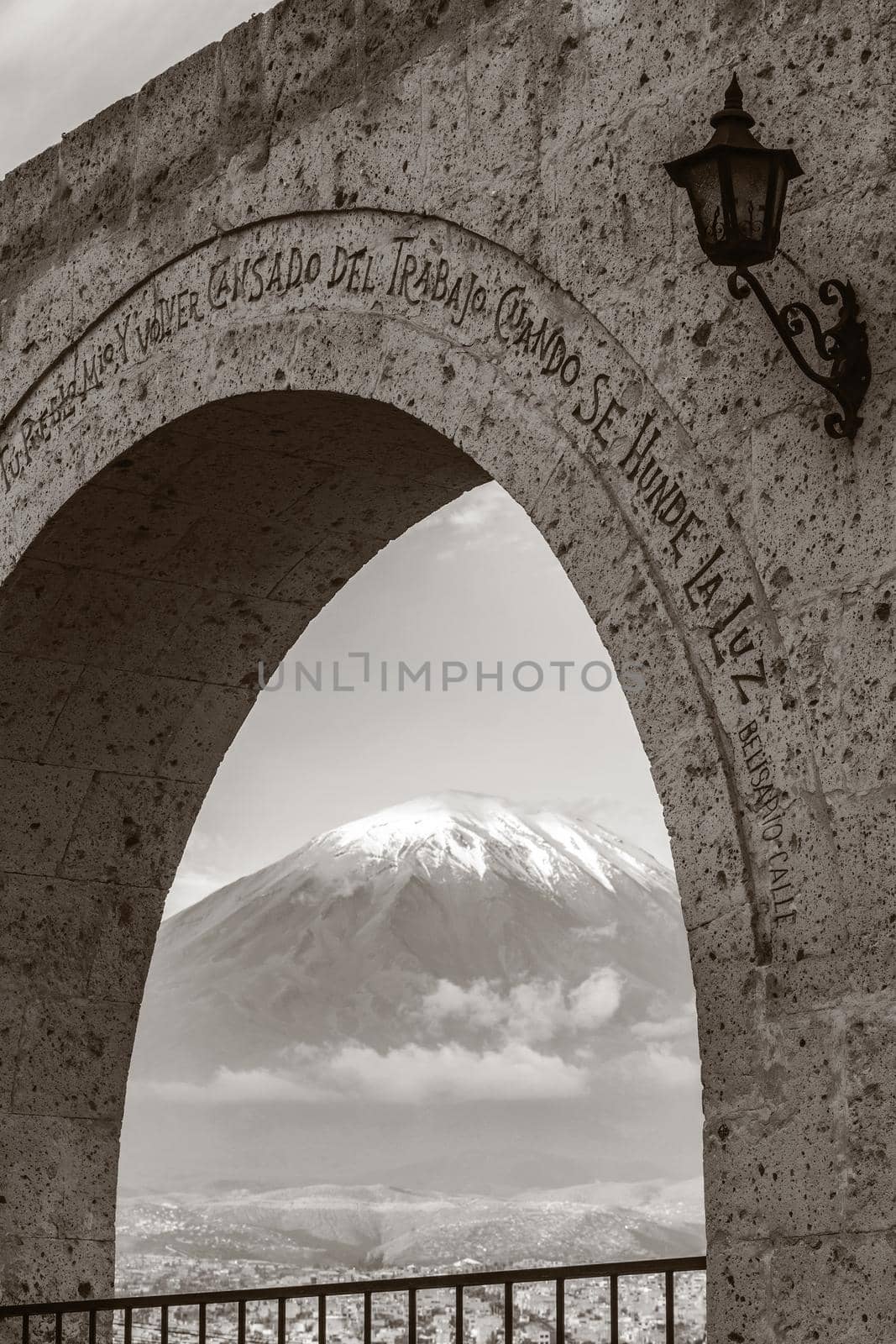 Monochromatic view of volcano Misti, Arequipa, Peru framed by arch in Yanahuara square