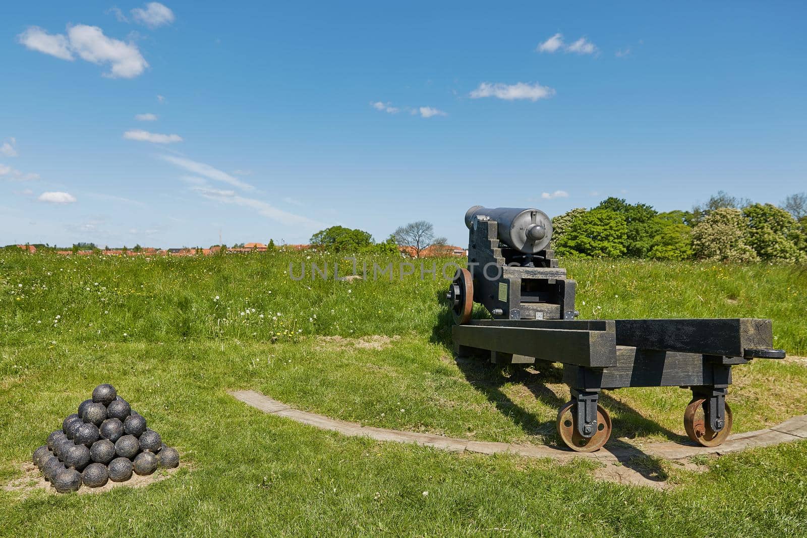 Old bronze cannon on rampart in city Fredericia, Denmark.