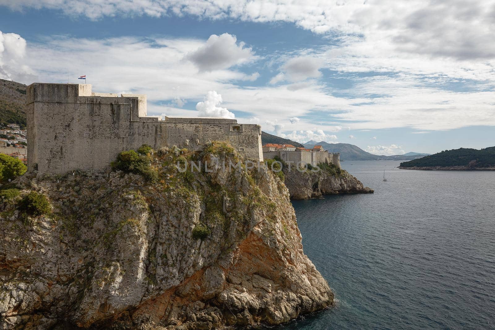 Ancient fortress on the cliff edge of Dubrovnik protects the port.