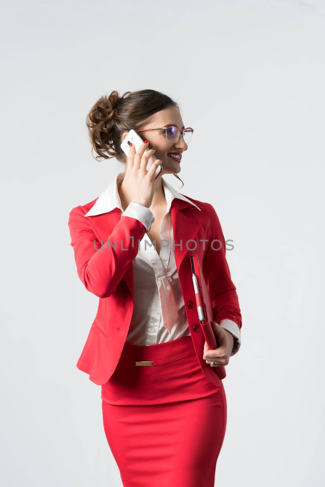 Businesswoman on the phone by Kzenon