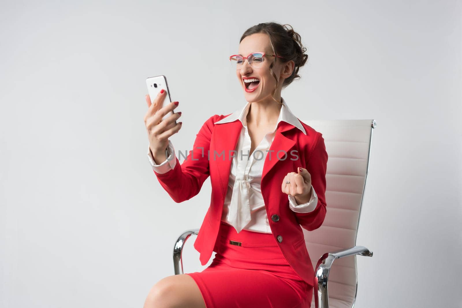 Businesswoman having great success just getting message on the phone