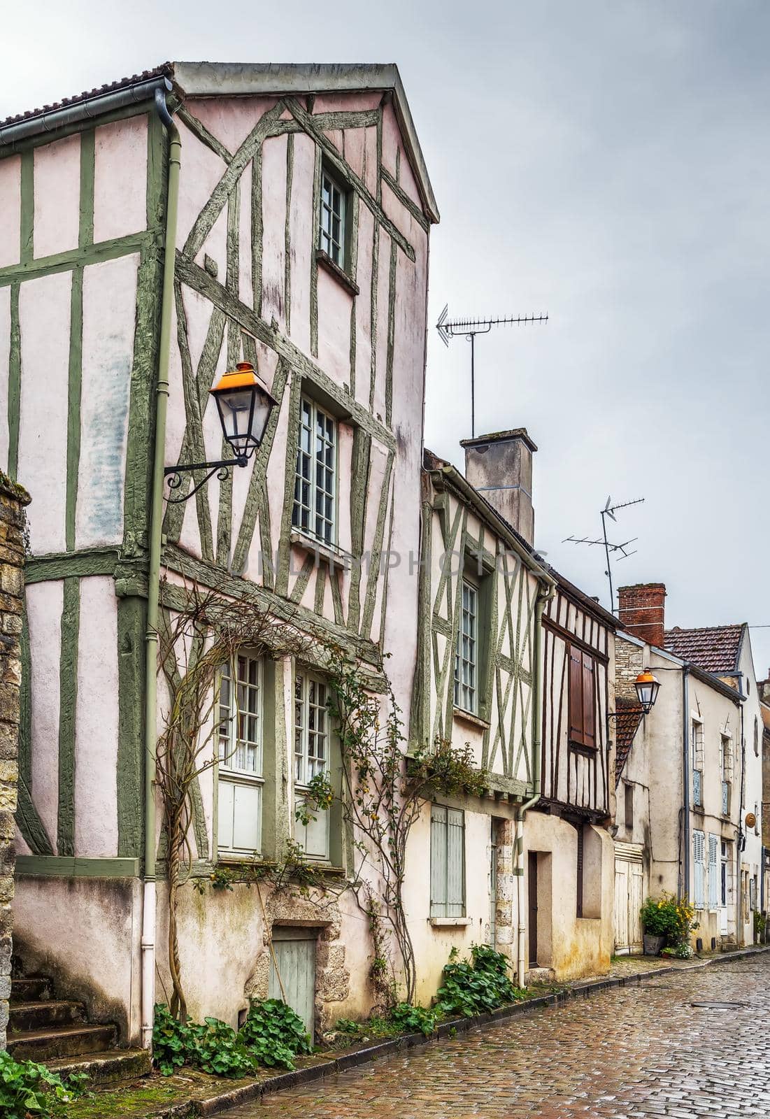 Street with historical half-timbered houses in Noyers (Noyers-sur-Serein), Yonne, France